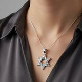 Model wearing the classic sterling silver Star of David charm on a neck chain